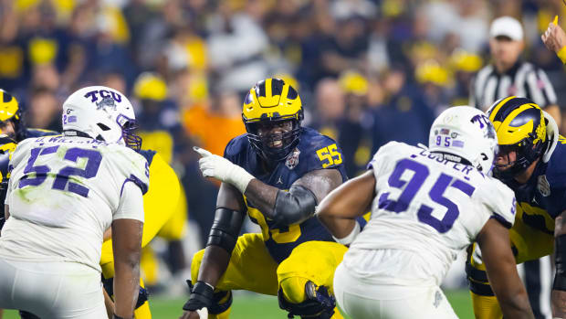 Olu Oluwatimi making line calls vs. TCU.